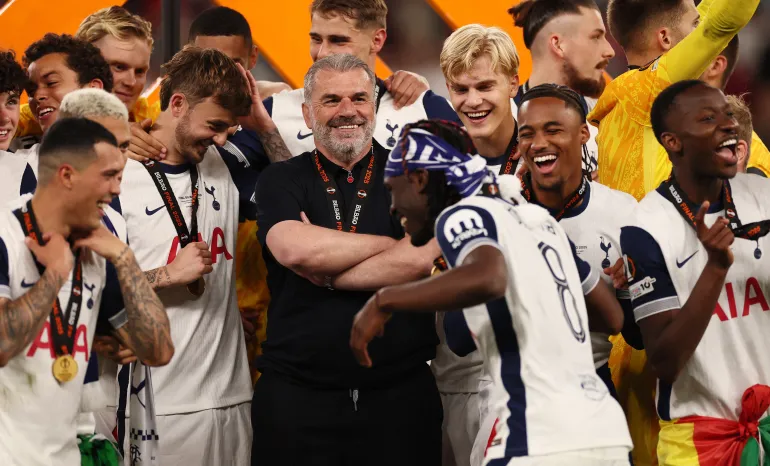Tottenham Hotspur manager Ange Postecoglou celebrates with his players after winning the Europa League
