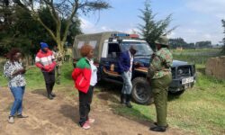 Jayne kihara with police outside her residence